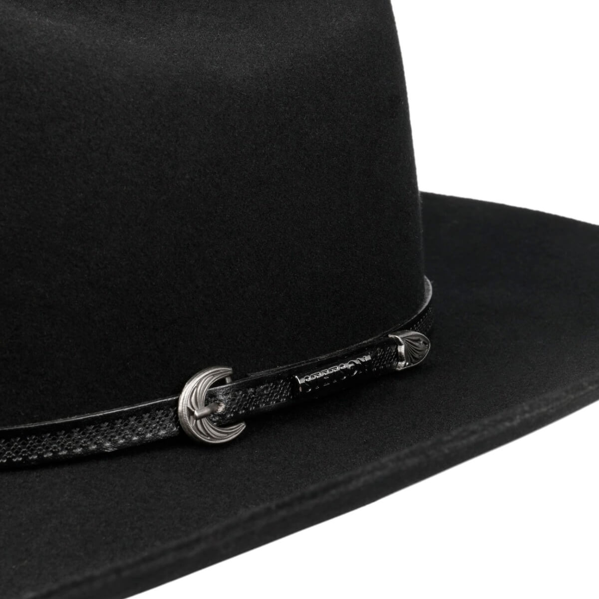 Black cowboy hat with a decorative band featuring a buckle on a white background