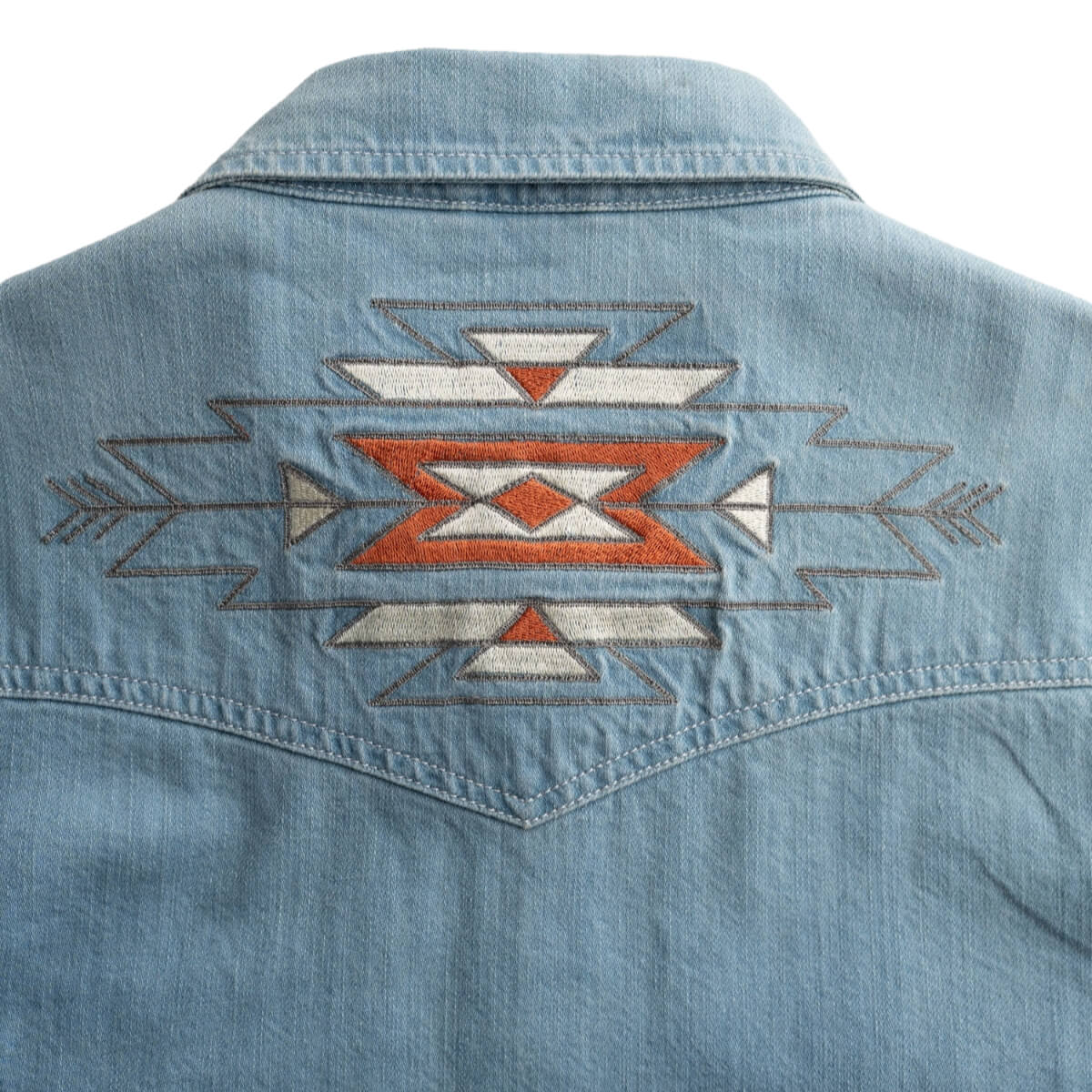Denim jacket with a geometric pattern on a white background