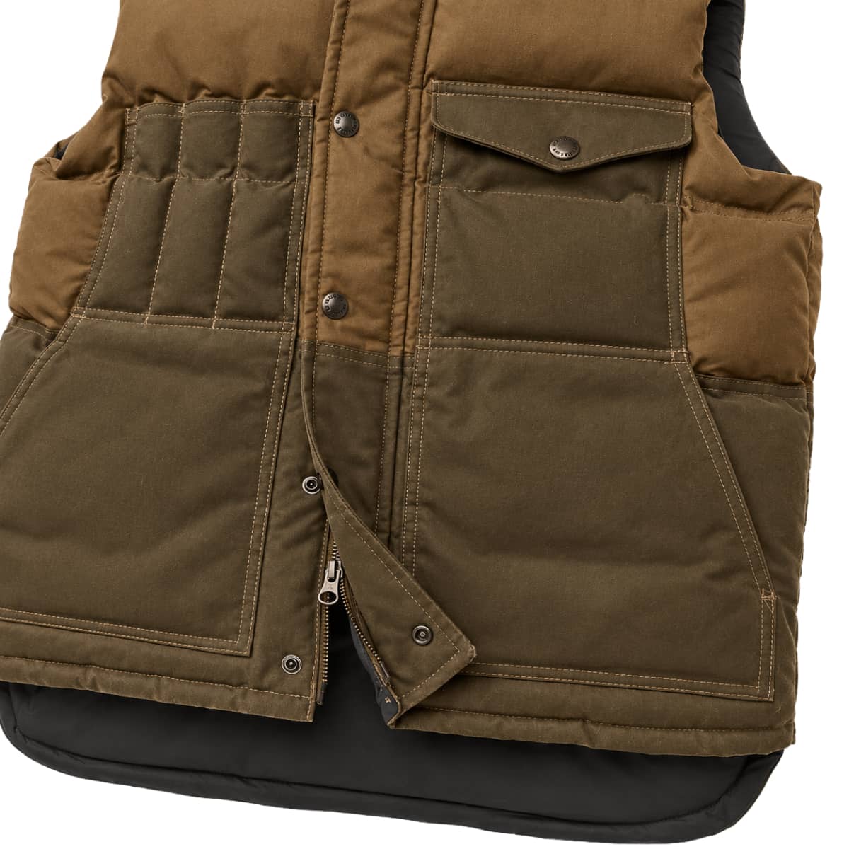 Close-up of a Filson Down Cruiser Vest with a brown upper section and an olive green lower body, featuring multiple front pockets and snap-button details.