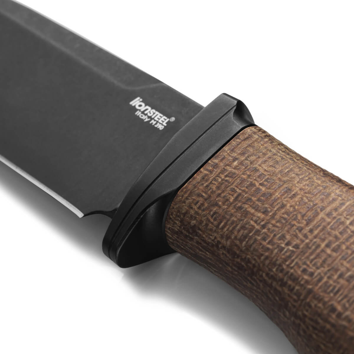 Close-up of a knife with a brown handle and black blade on a white background