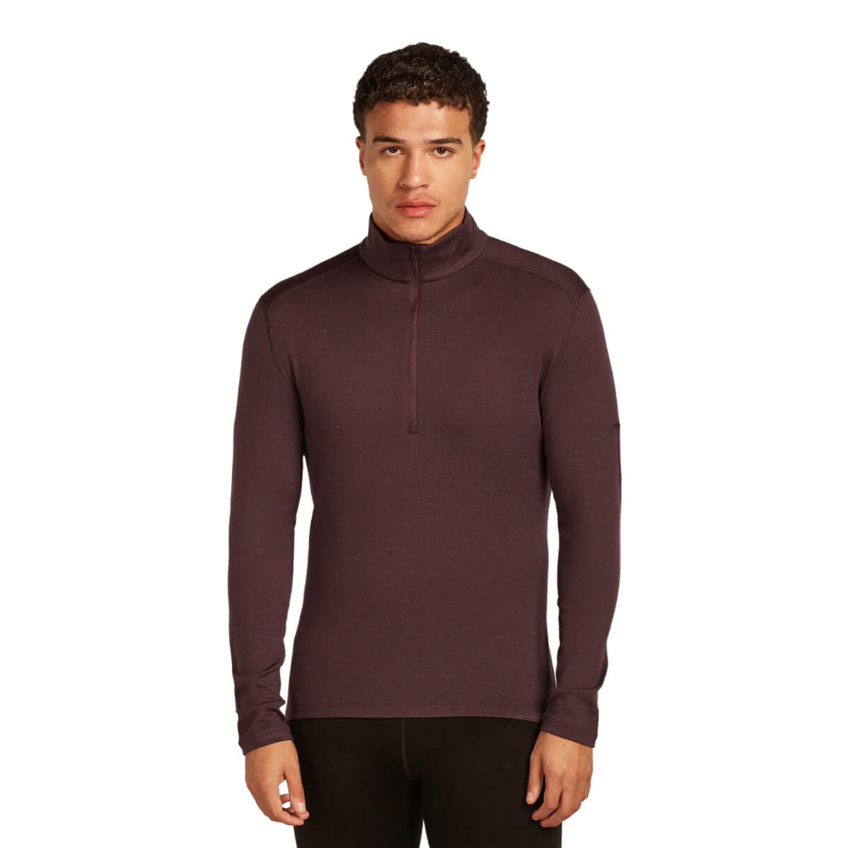 Man wearing a brown long-sleeve shirt with a quarter-zip on a white background