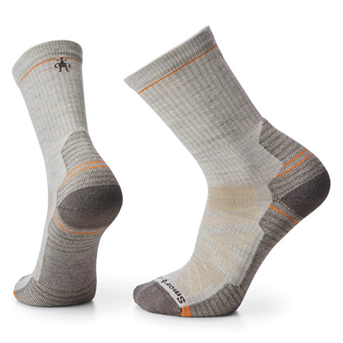 Pair of gray hiking socks with orange accents on a white background
