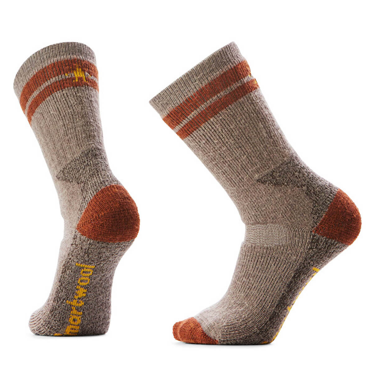 Pair of brown socks with orange accents on a white background